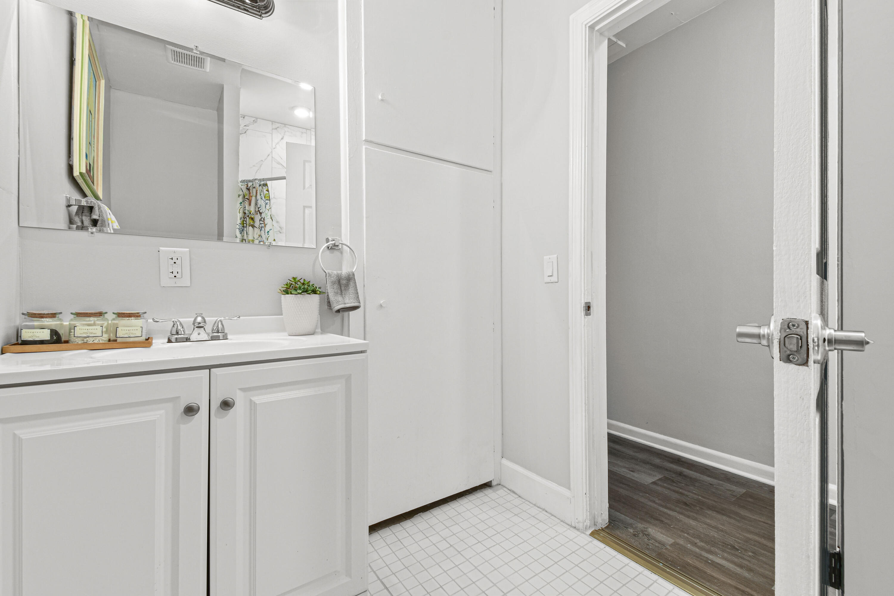 1102 Sunset Road West Palm Beach, FL 33401 - Photo 23 of 37 a bathroom with a sink and a mirror
