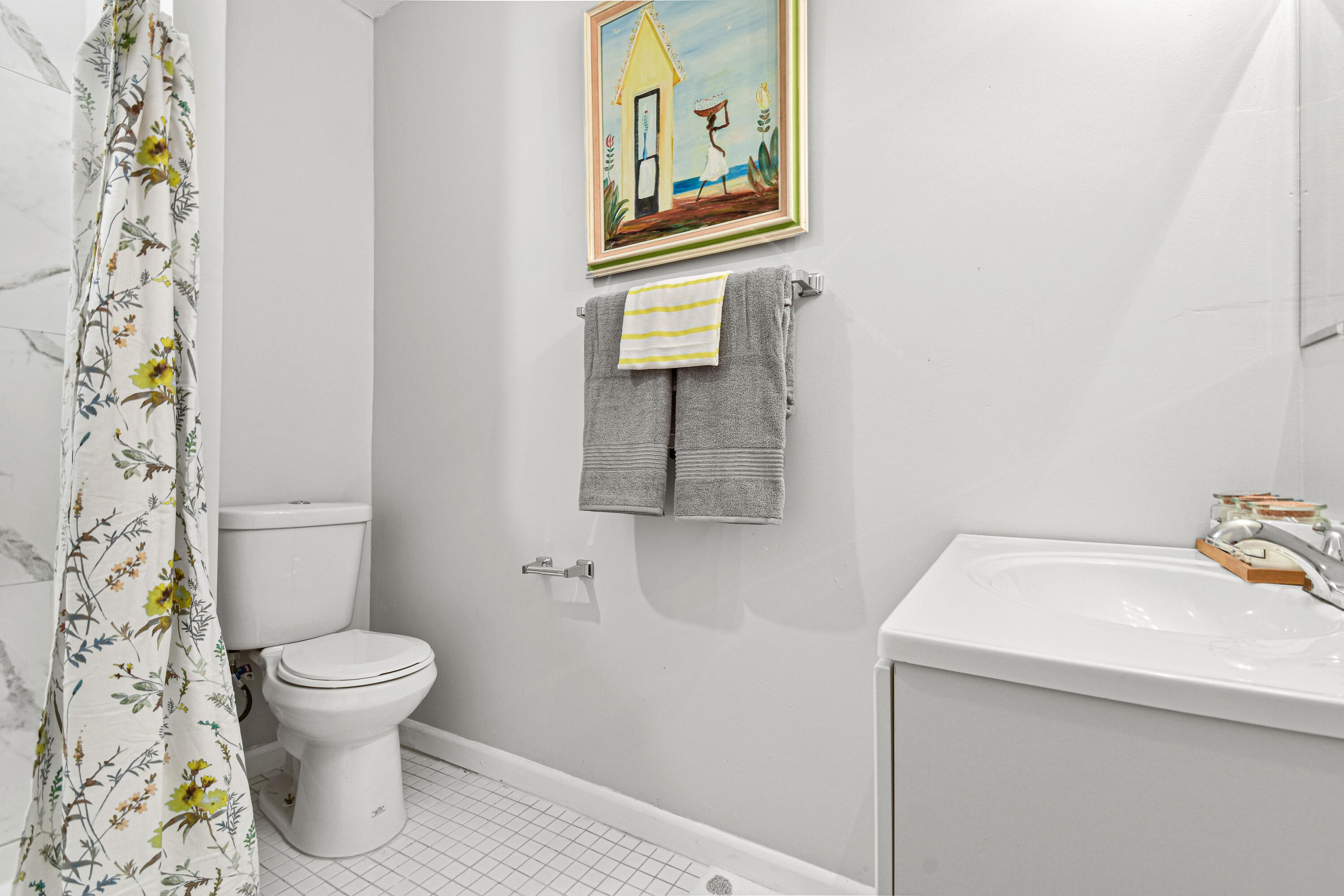 1102 Sunset Road West Palm Beach, FL 33401 - Photo 25 of 37 a bathroom with a sink and a toilet