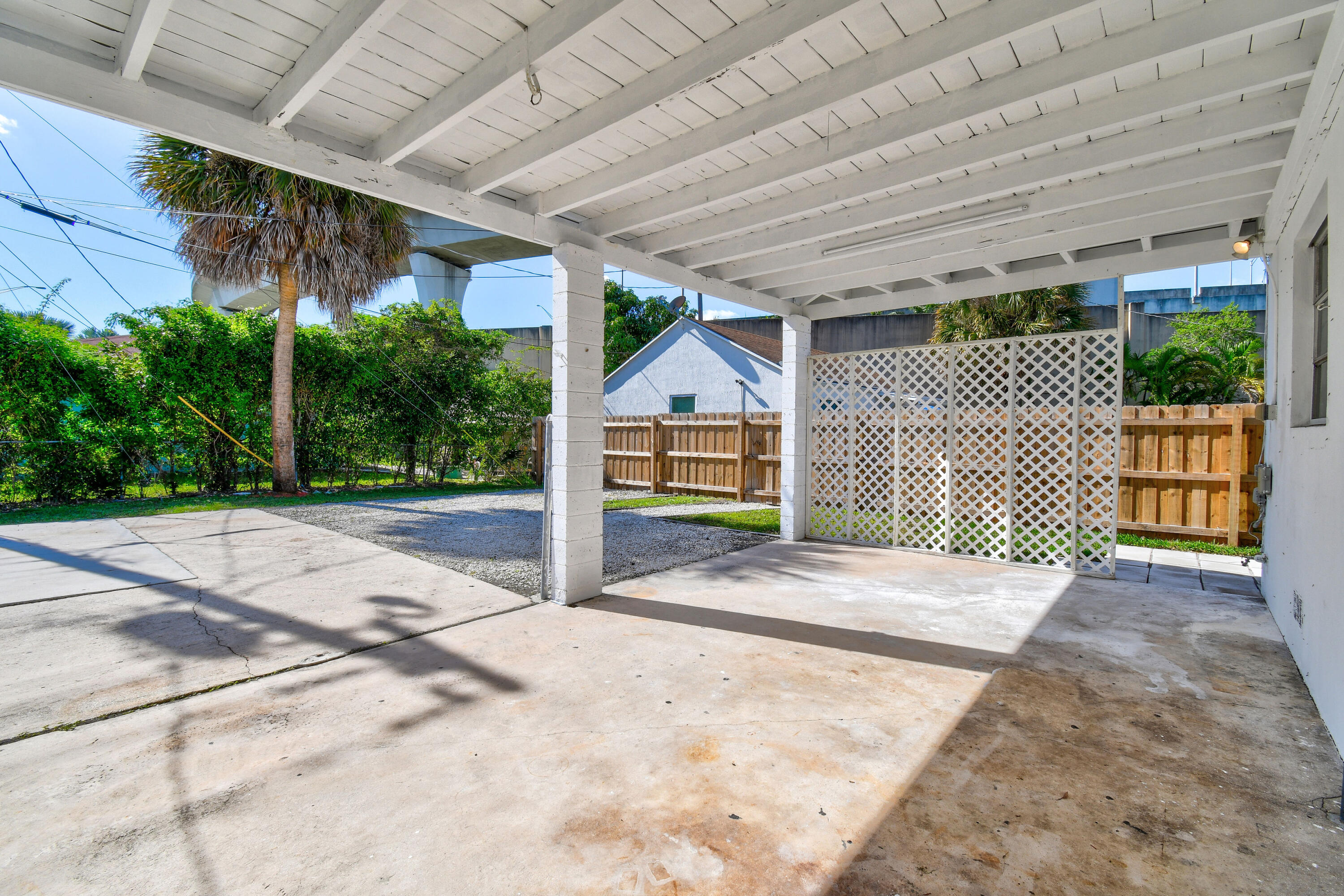 1102 Sunset Road West Palm Beach, FL 33401 - Photo 29 of 37 a front view of a house with a garage