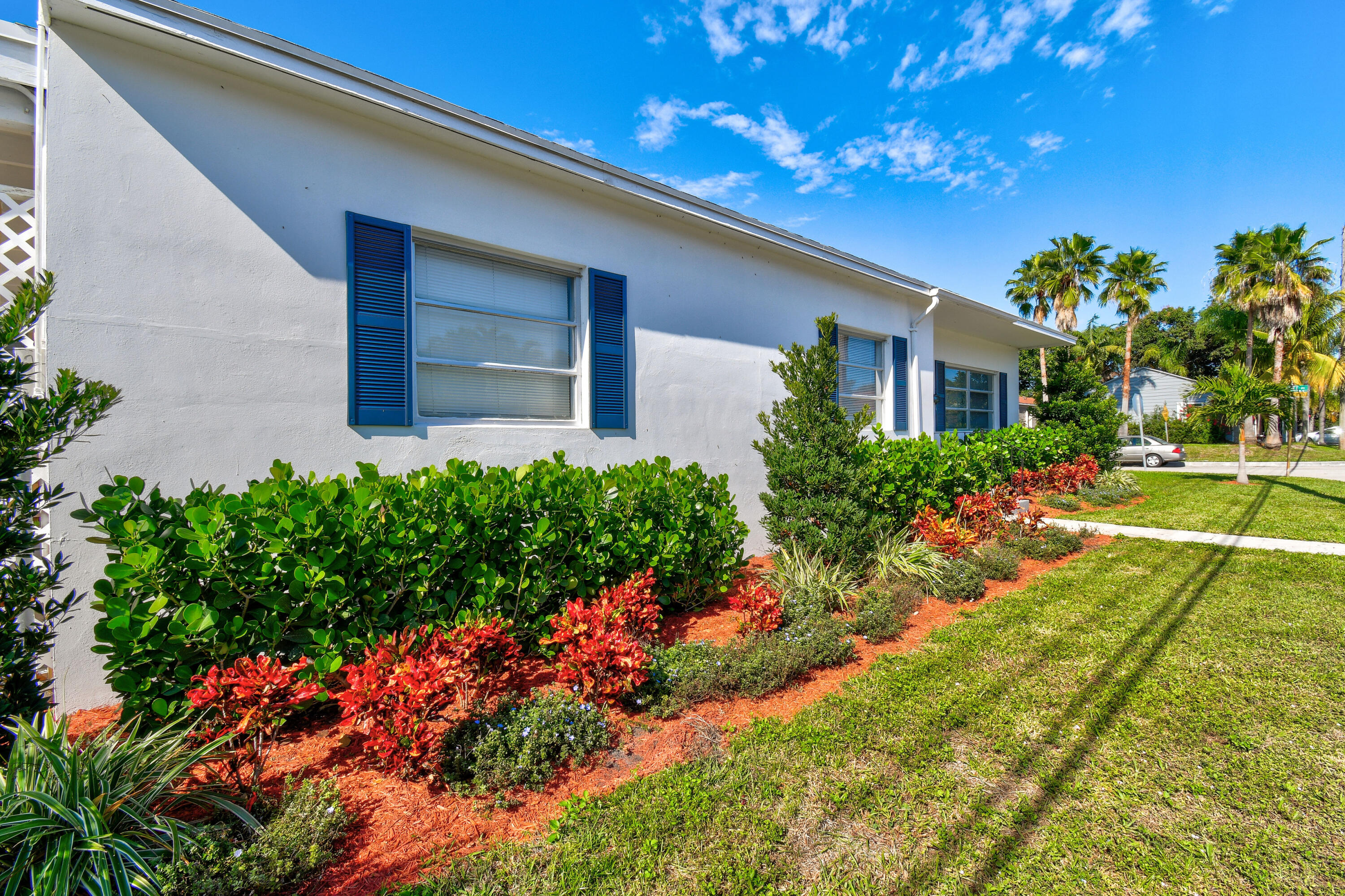1102 Sunset Road West Palm Beach, FL 33401 - Photo 36 of 37 a front view of a house with a yard