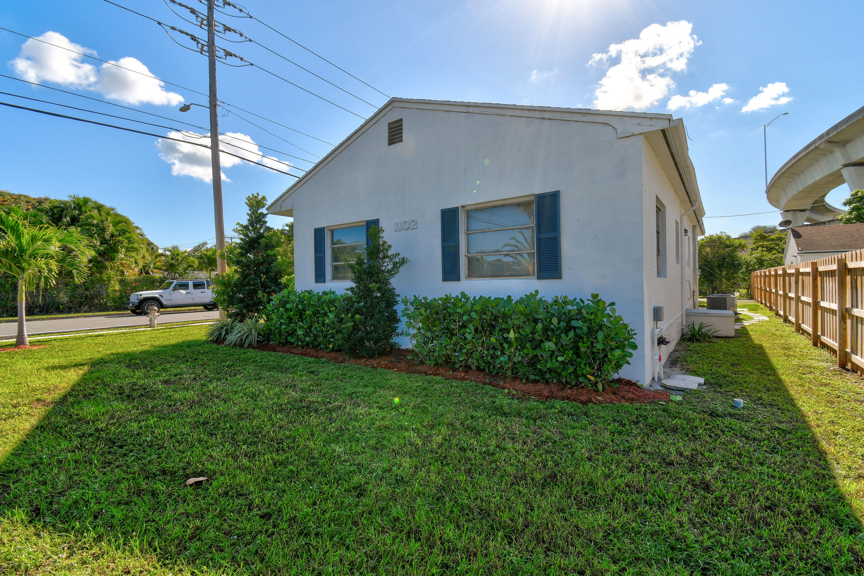 1102 Sunset Road West Palm Beach, FL 33401 - Photo 37 of 37 a view of a house with a yard