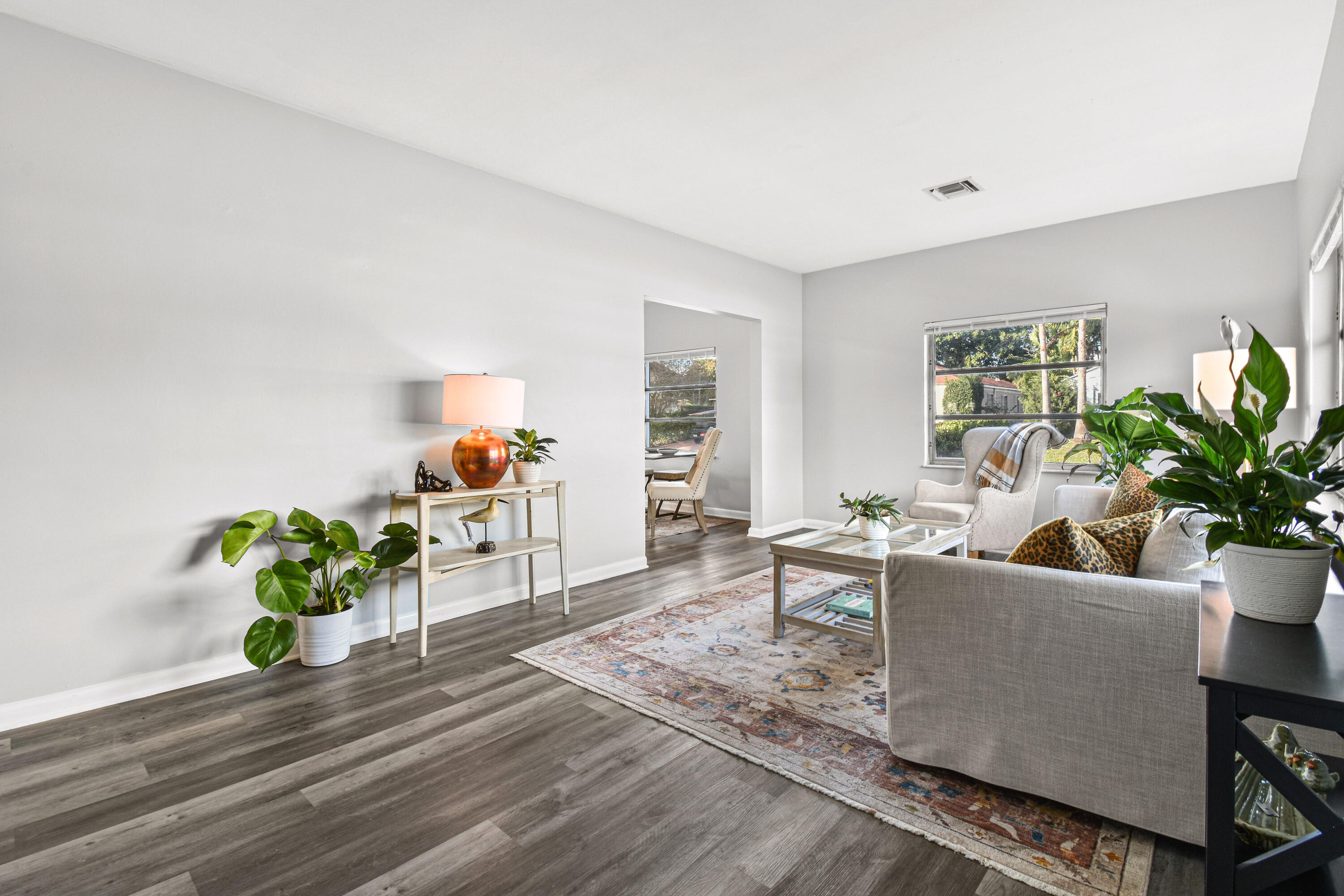 1102 Sunset Road West Palm Beach, FL 33401 - Photo 4 of 37 a living room with furniture potted plant and a window