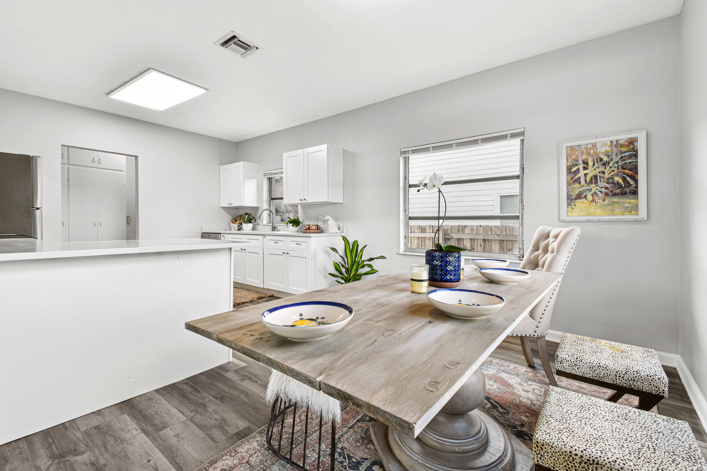 1102 Sunset Road West Palm Beach, FL 33401 - Photo 10 of 37 a dining room with furniture and window