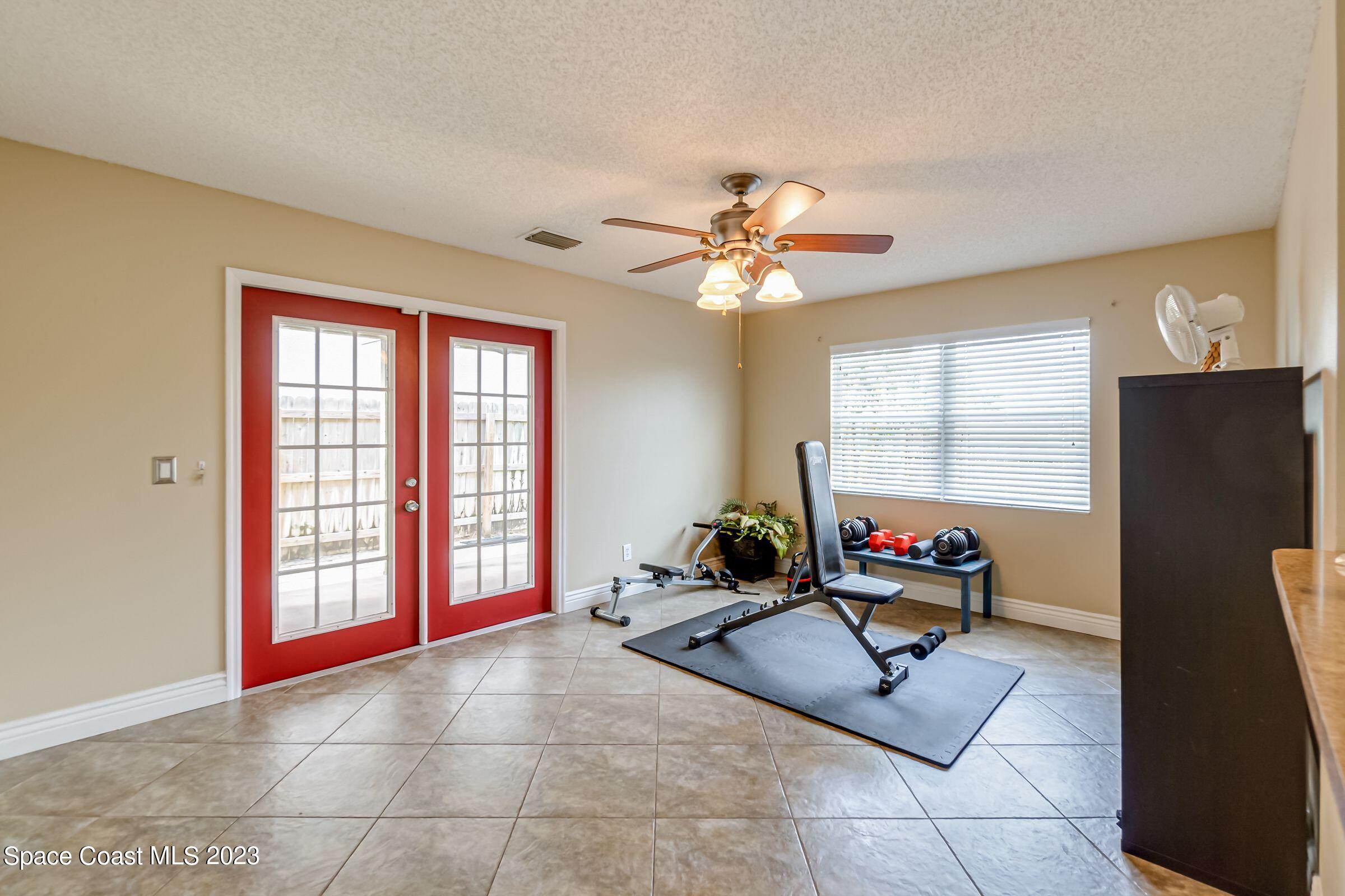 4540 Rivermist Drive Melbourne, FL 32935 - Photo 17 of 39 a living room with furniture pool table and a window