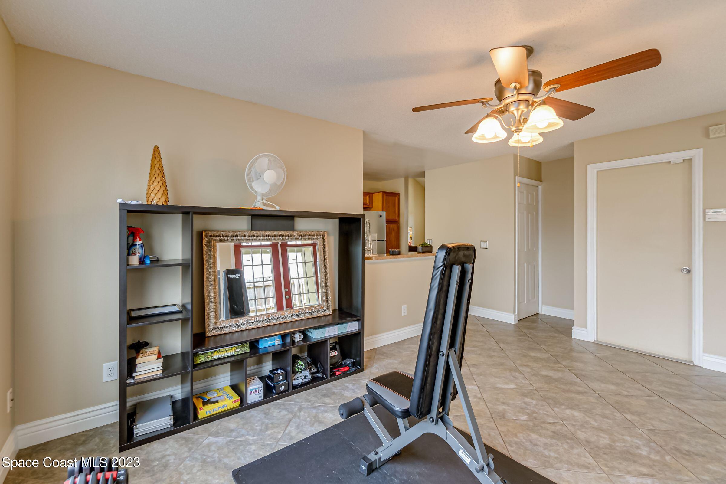 4540 Rivermist Drive Melbourne, FL 32935 - Photo 19 of 39 a workspace with chandelier