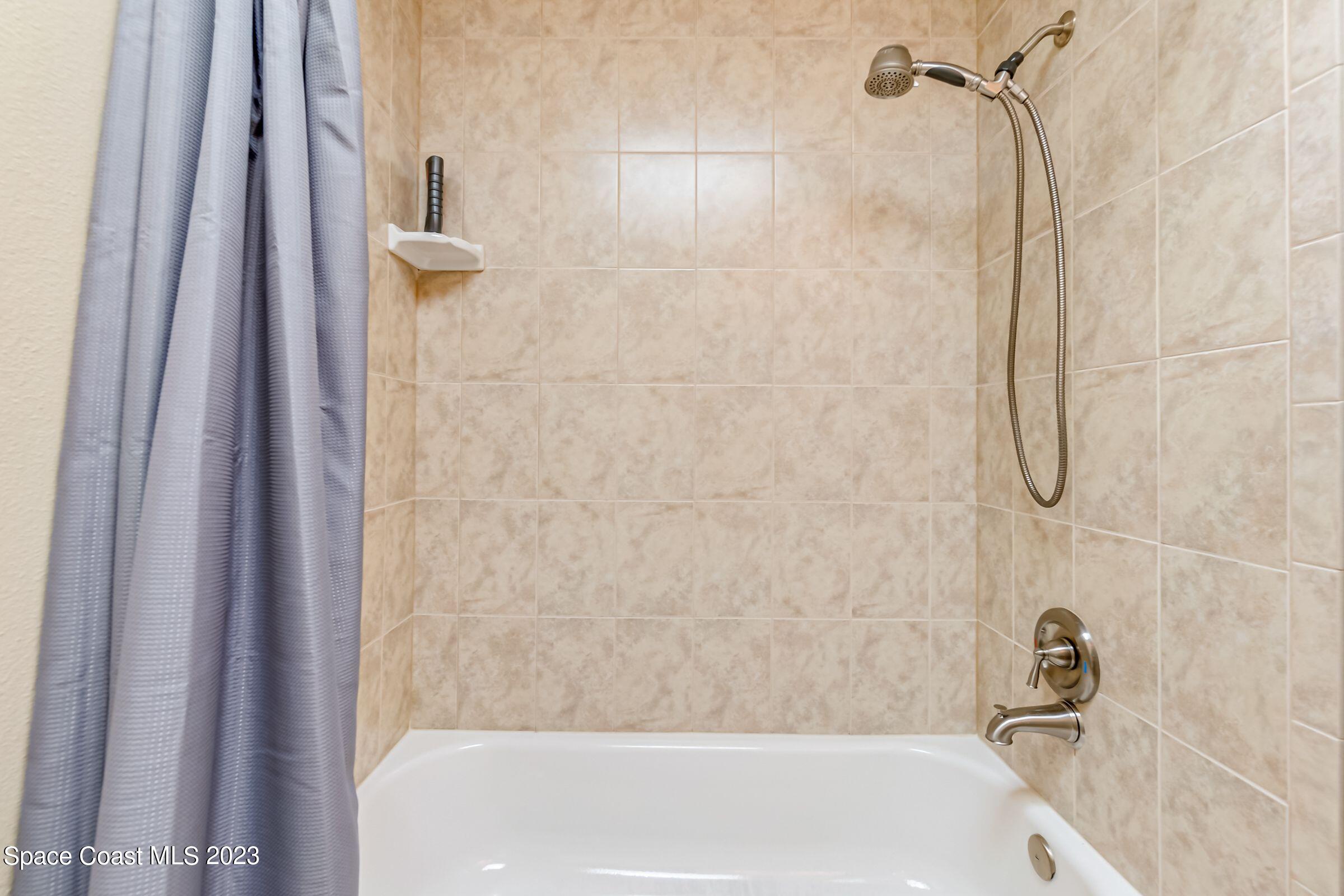 4540 Rivermist Drive Melbourne, FL 32935 - Photo 29 of 39 a bathroom with a bathtub
