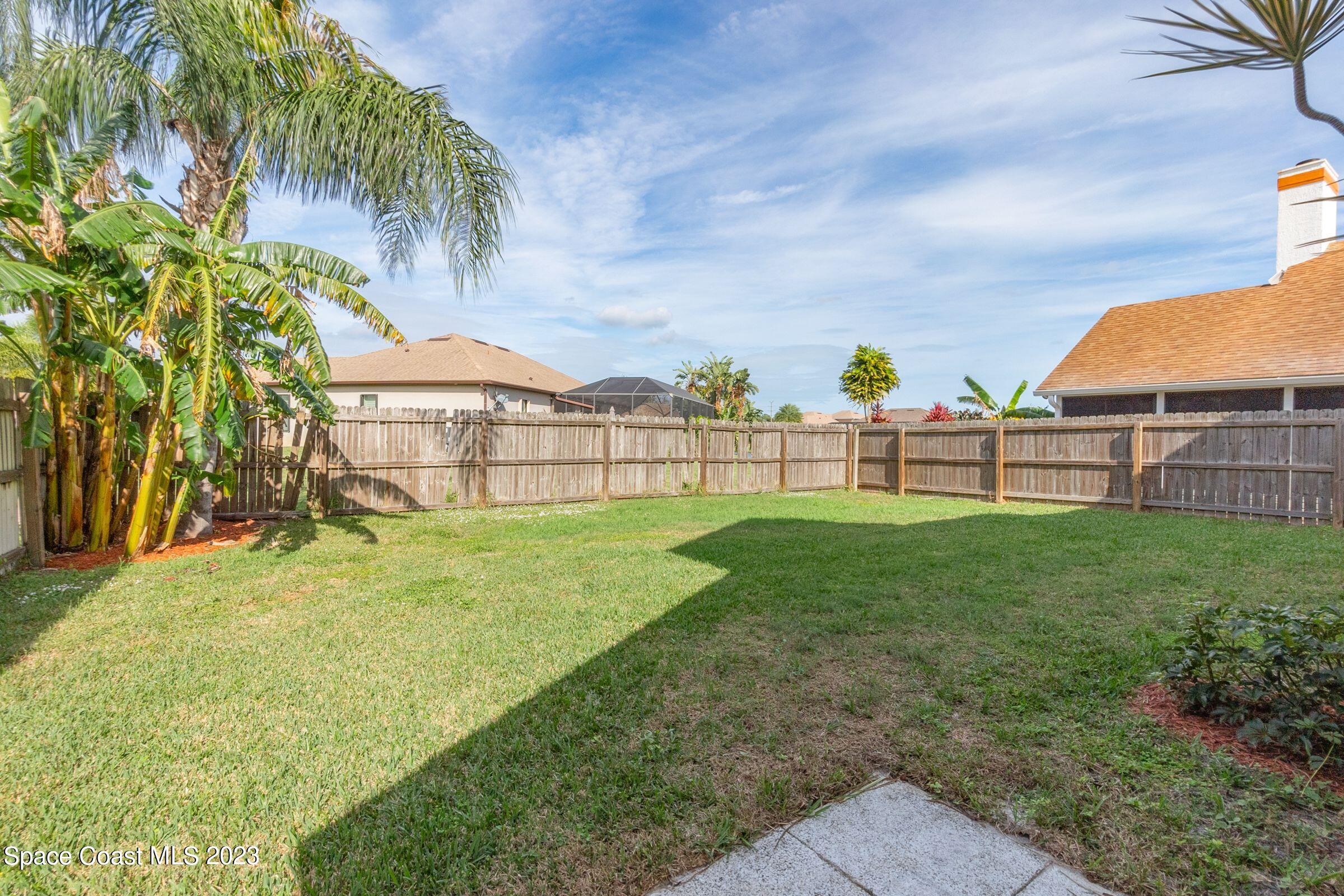 4540 Rivermist Drive Melbourne, FL 32935 - Photo 34 of 39 a view of a garden with a large trees
