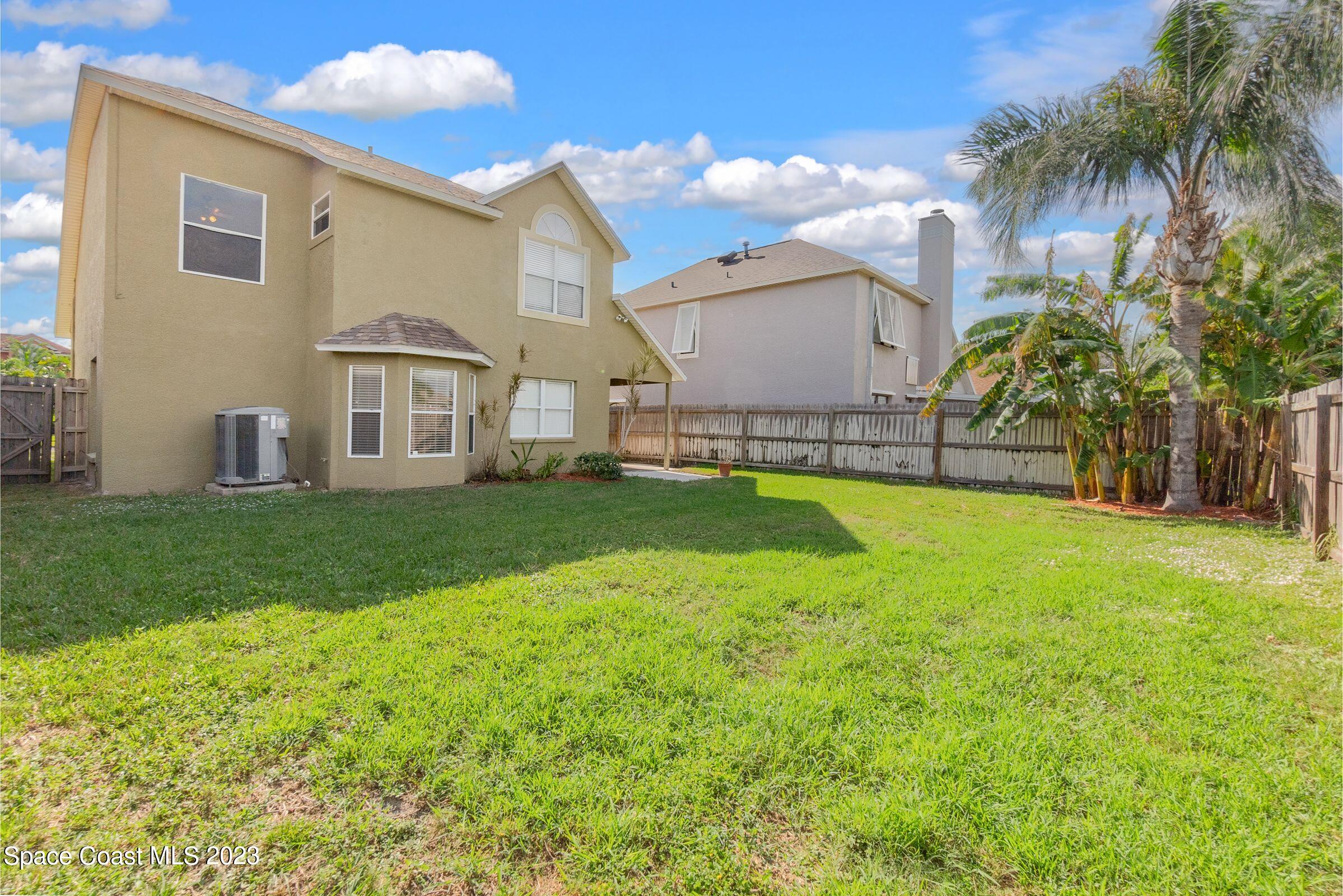 4540 Rivermist Drive Melbourne, FL 32935 - Photo 36 of 39 a view of a house with a backyard