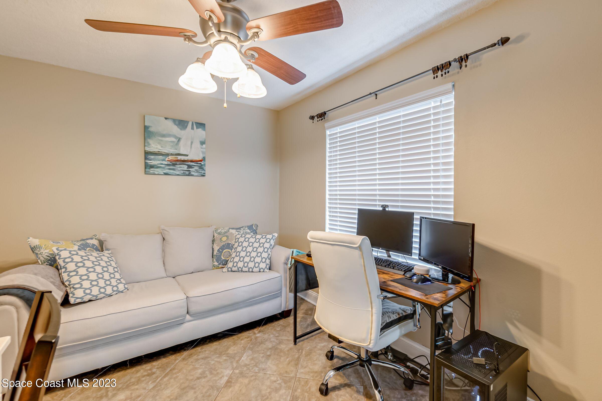 4540 Rivermist Drive Melbourne, FL 32935 - Photo 8 of 39 a work room with furniture and a window
