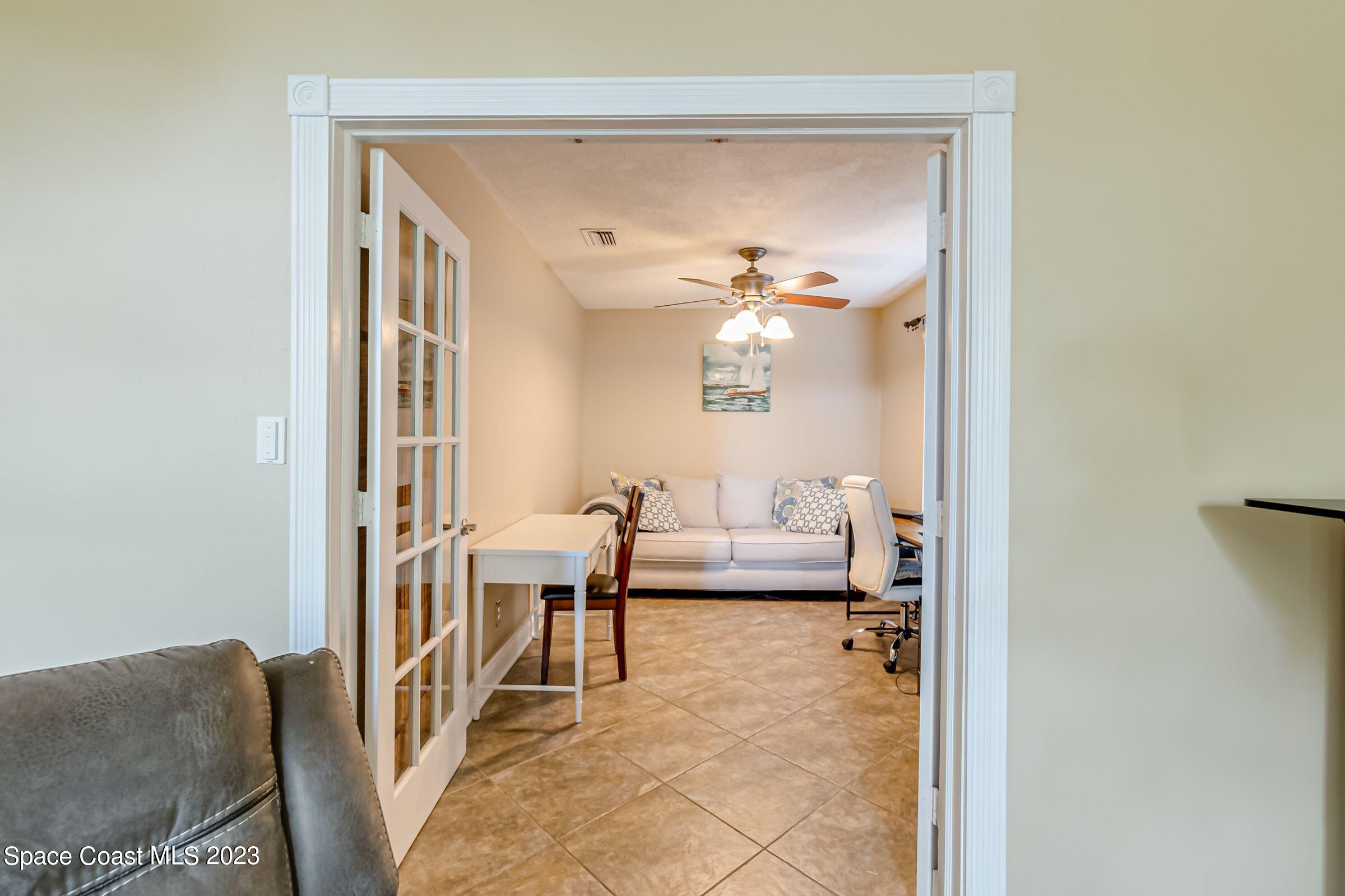4540 Rivermist Drive Melbourne, FL 32935 - Photo 9 of 39 a living room with furniture and a table