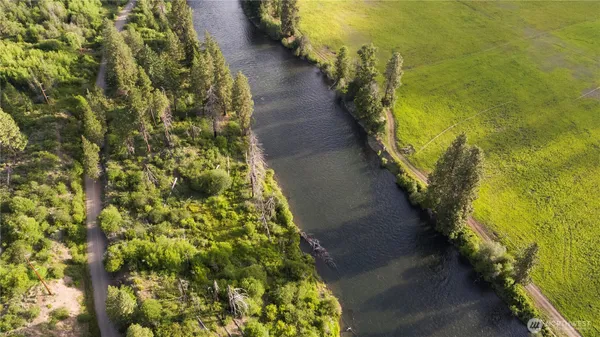 a view of a pathway both side of a lake view