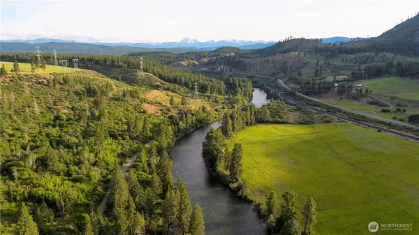 a view of a swimming pool with mountains in the background