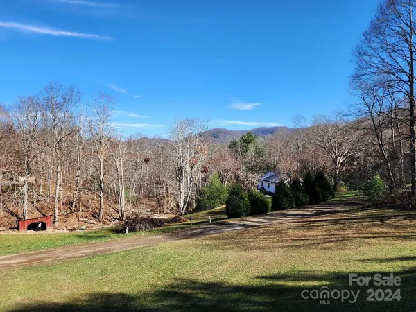 a view of a backyard with sitting area