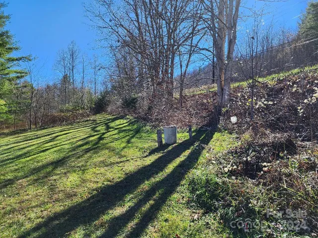 a water heater room with wooden floor