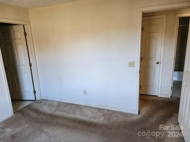 a view of a bathroom with a tub and a toilet