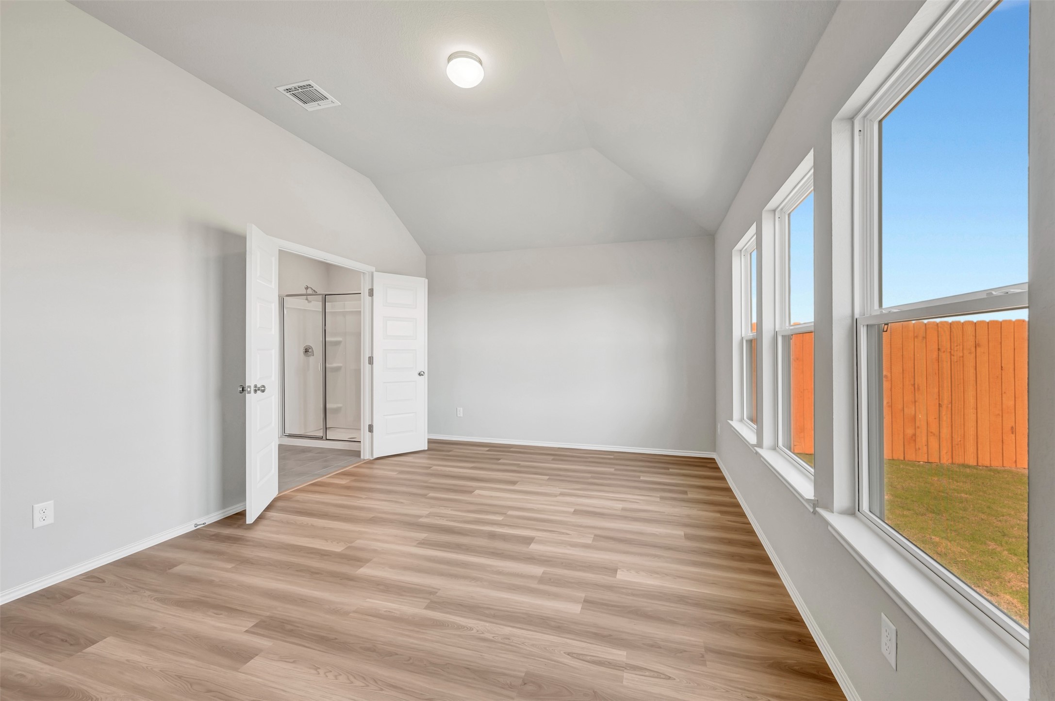 13709 Warnock Trail Manor, TX 78653 - Photo 13 of 40 wooden floor in an empty room with a window
