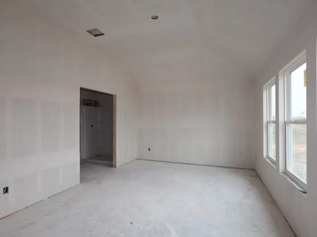 a view of an empty room and window