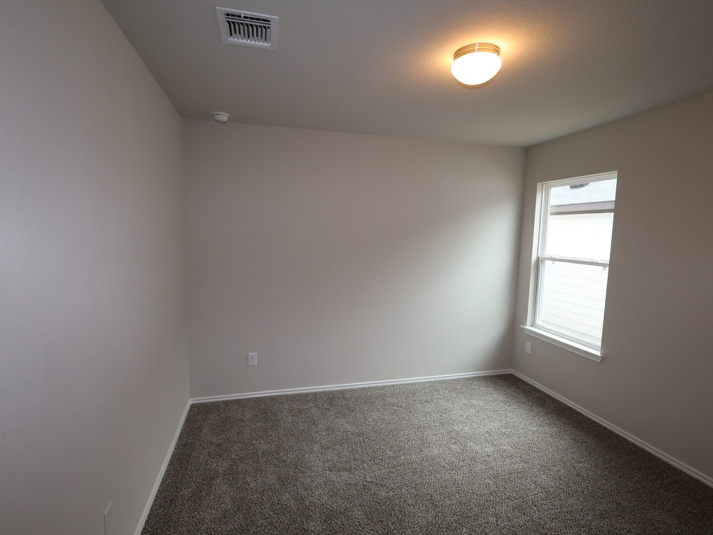 13709 Warnock Trail Manor, TX 78653 - Photo 18 of 25 an empty room with a window
