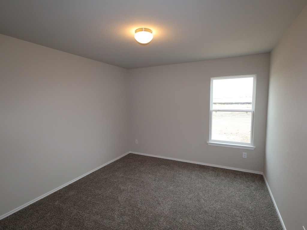 13709 Warnock Trail Manor, TX 78653 - Photo 20 of 25 an empty room with a window