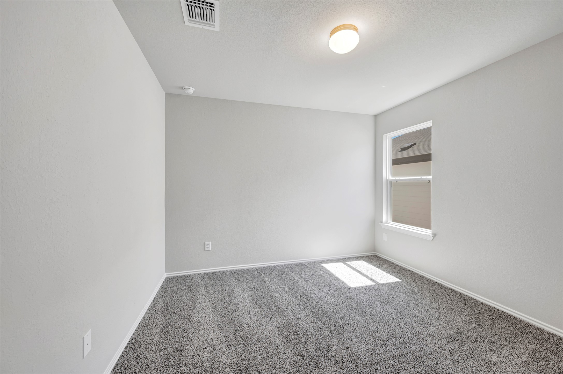 13709 Warnock Trail Manor, TX 78653 - Photo 25 of 40 an empty room with a empty space and windows