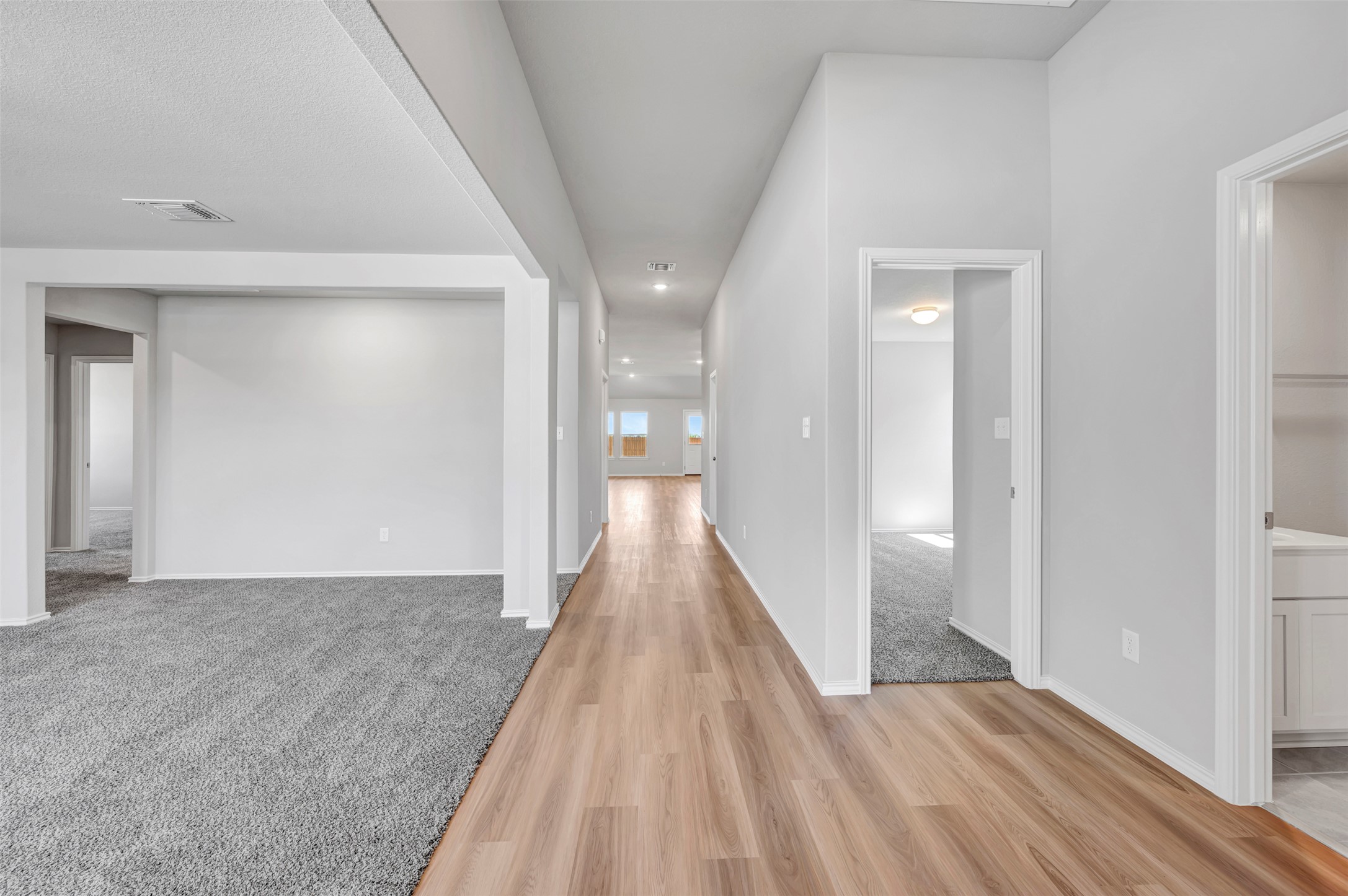 13709 Warnock Trail Manor, TX 78653 - Photo 28 of 40 a view of a hallway with wooden floor