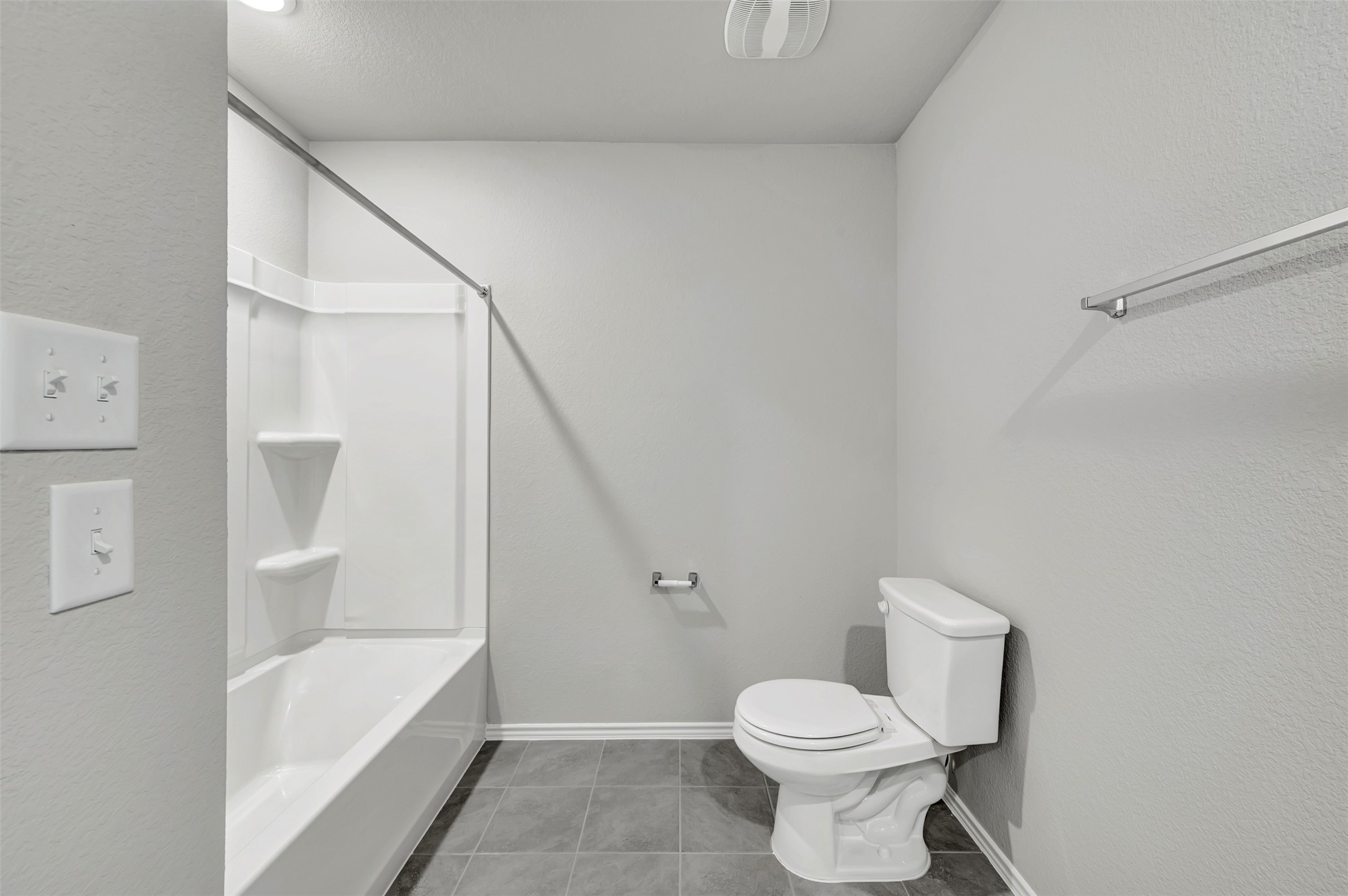 13709 Warnock Trail Manor, TX 78653 - Photo 31 of 40 a bathroom with a toilet sink and mirror