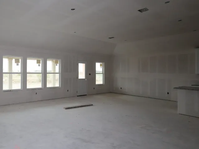 an empty room with windows