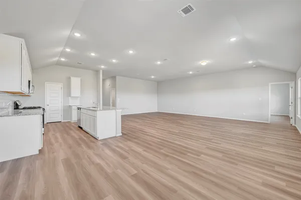 a view of kitchen with wooden floor