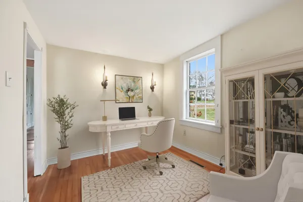 a living room with furniture and a table