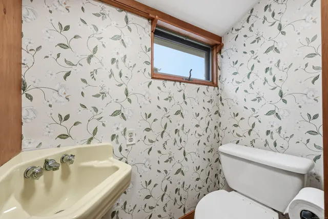 a view of an empty room and wooden floor