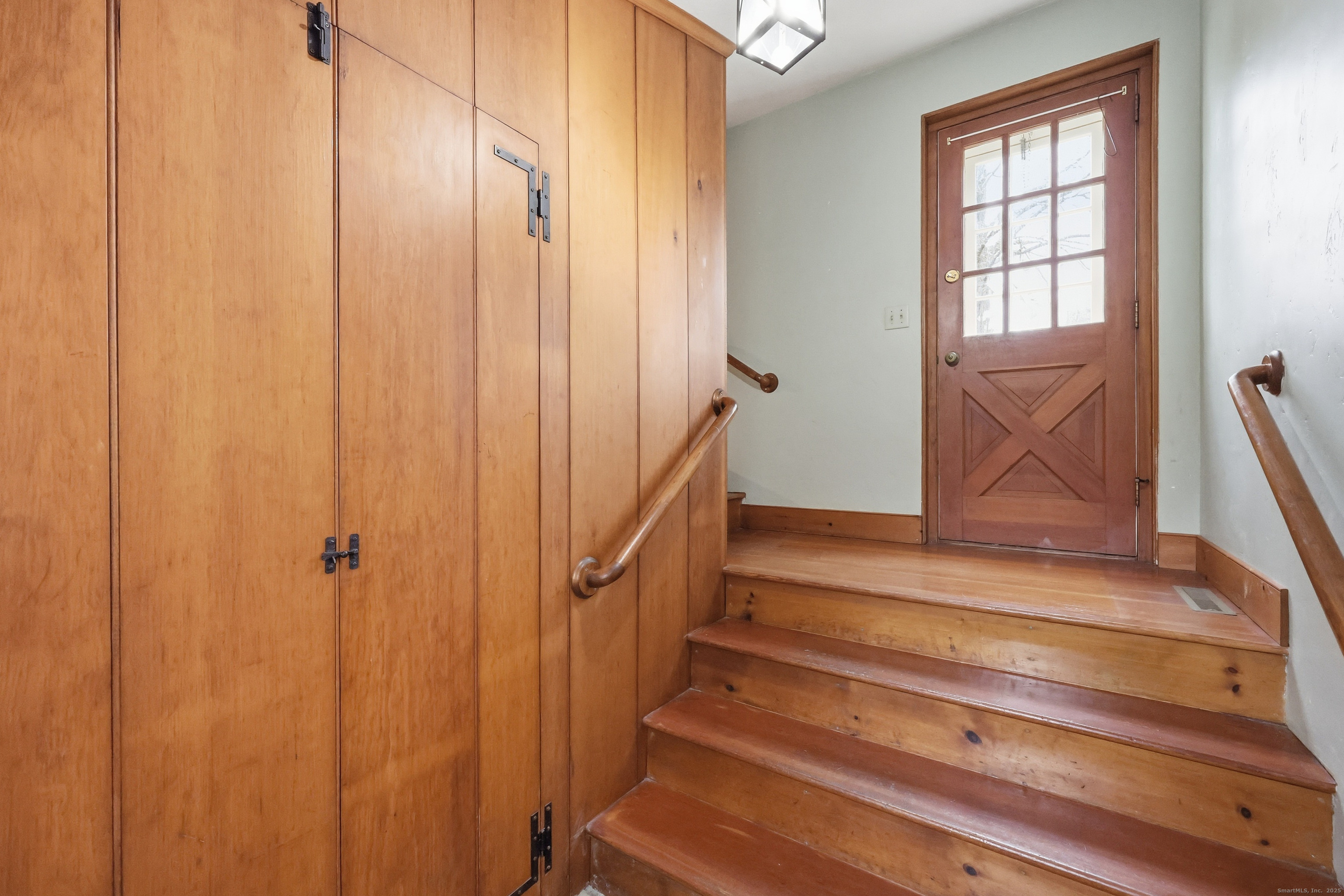 268 Main Street Durham, CT 06422 - Photo 21 of 40 Side entry with coat closet, access to cold storage room, & door leading out to back patio.