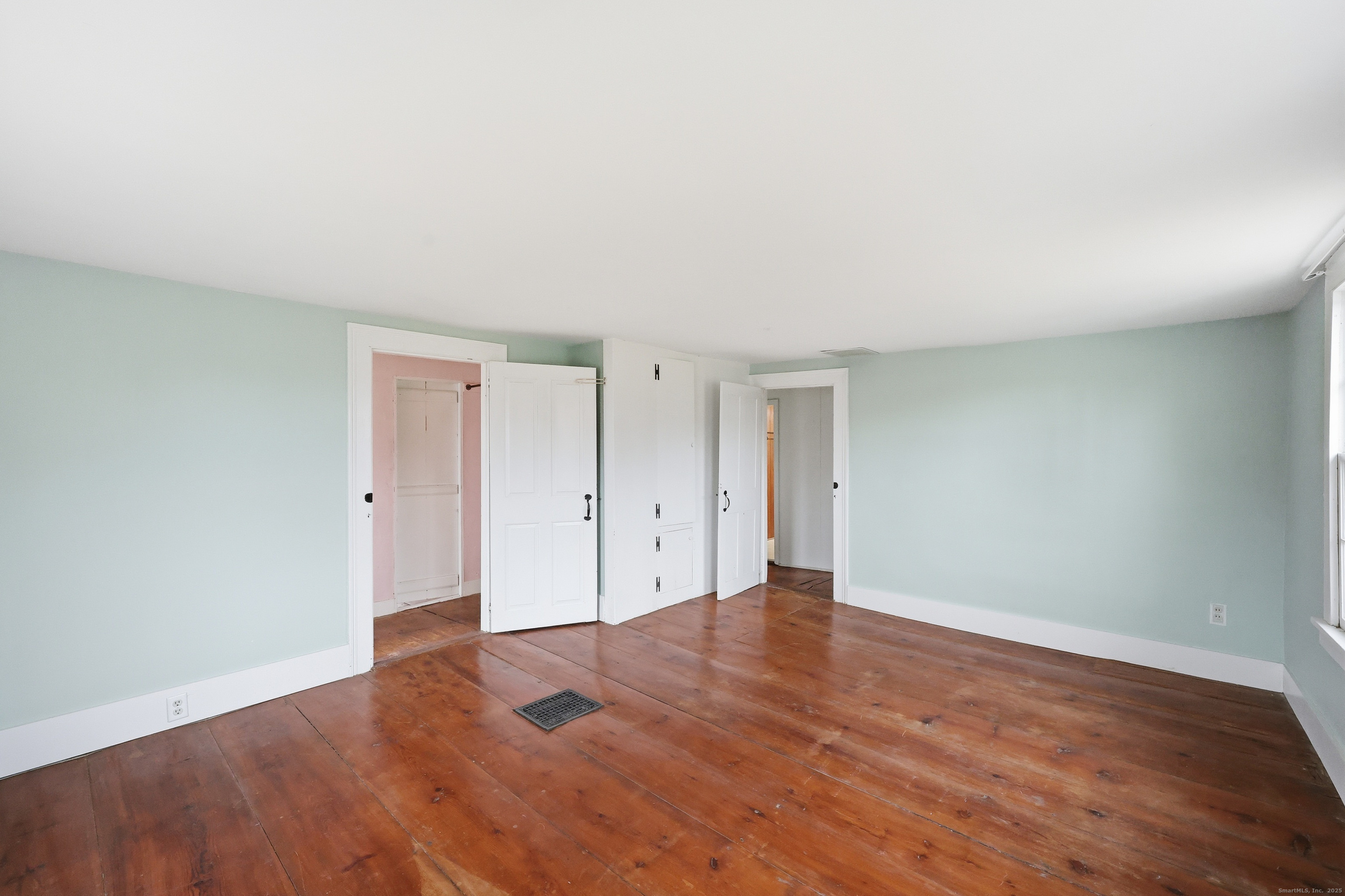 268 Main Street Durham, CT 06422 - Photo 22 of 40 a view of an empty room and wooden floor