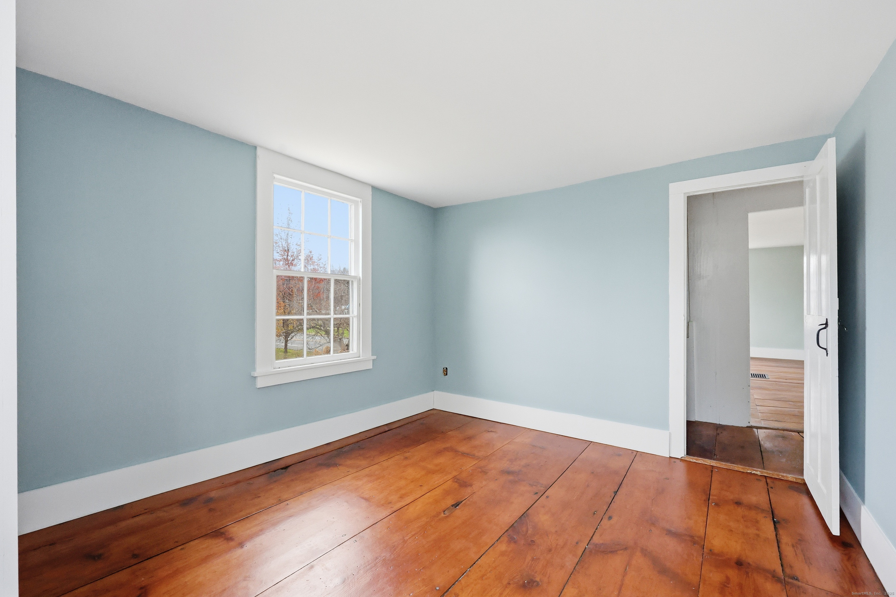 268 Main Street Durham, CT 06422 - Photo 25 of 40 an empty room with wooden floor and windows