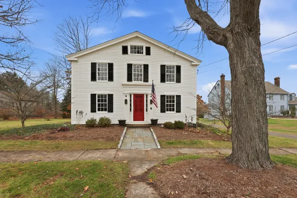 a front view of a house with a yard