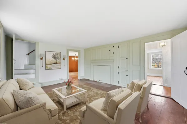 a living room with furniture and a table