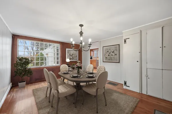 a view of a dining room with furniture window and outside view