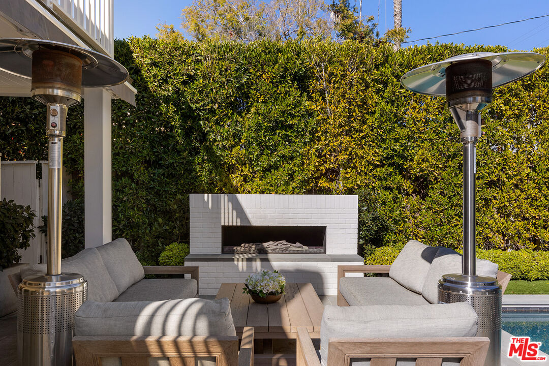 369 22nd Street Santa Monica, CA 90402 - Photo 13 of 29 a view of a patio with couches table and chairs and potted plants