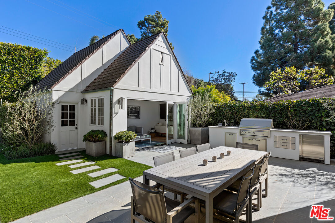 369 22nd Street Santa Monica, CA 90402 - Photo 14 of 29 a view of backyard with table and chairs and potted plants