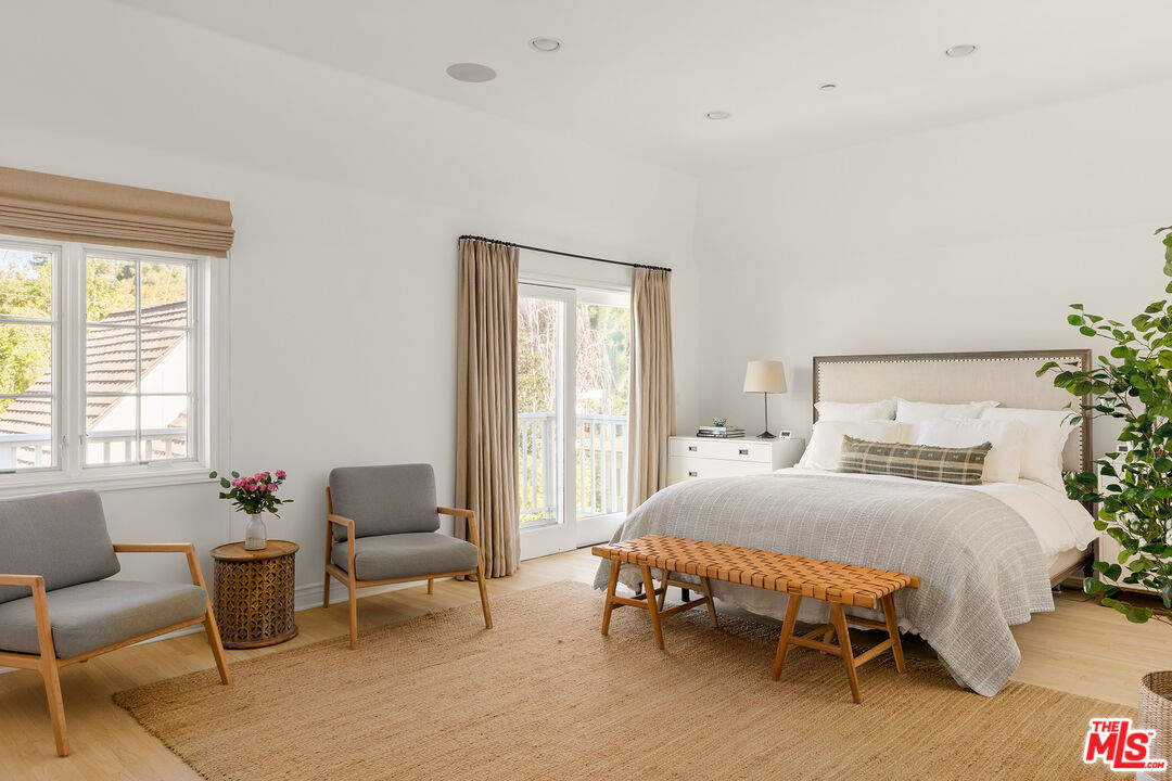 369 22nd Street Santa Monica, CA 90402 - Photo 17 of 29 a bedroom with a bed chair and a window