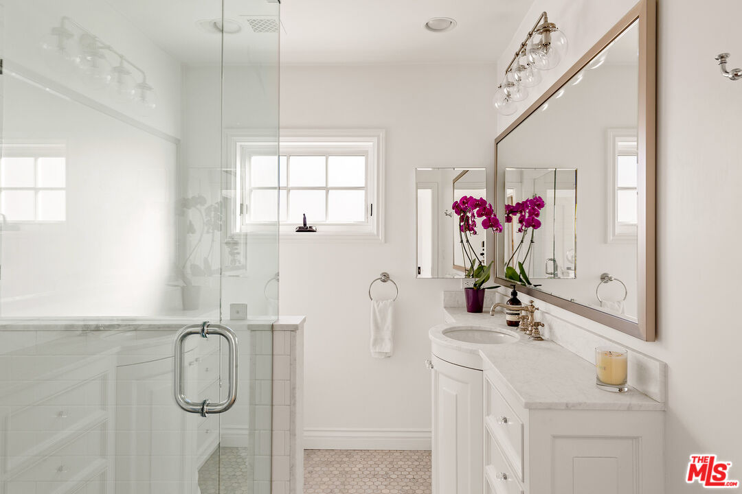369 22nd Street Santa Monica, CA 90402 - Photo 22 of 29 a bathroom with a sink vanity tub and shower