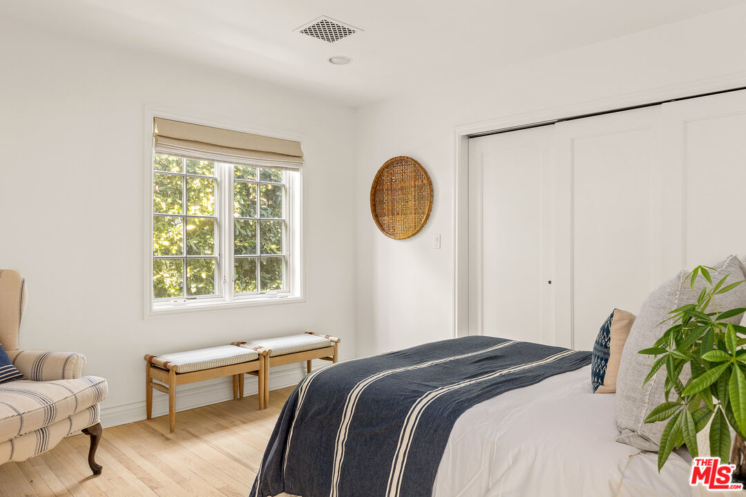 369 22nd Street Santa Monica, CA 90402 - Photo 26 of 29 a bedroom with a bed and a window