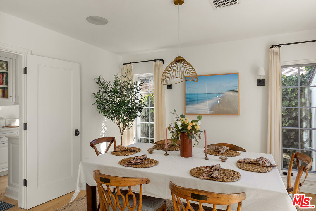 369 22nd Street Santa Monica, CA 90402 - Photo 6 of 29 a view of a dining room and kitchen with furniture window and wooden floor