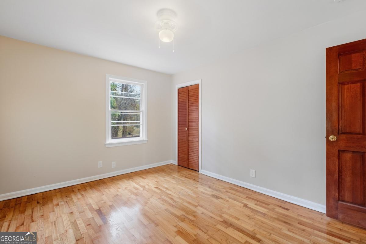 14 Mitchell Circle Rome, GA 30161 - Photo 39 of 39 an empty room with wooden floor and windows