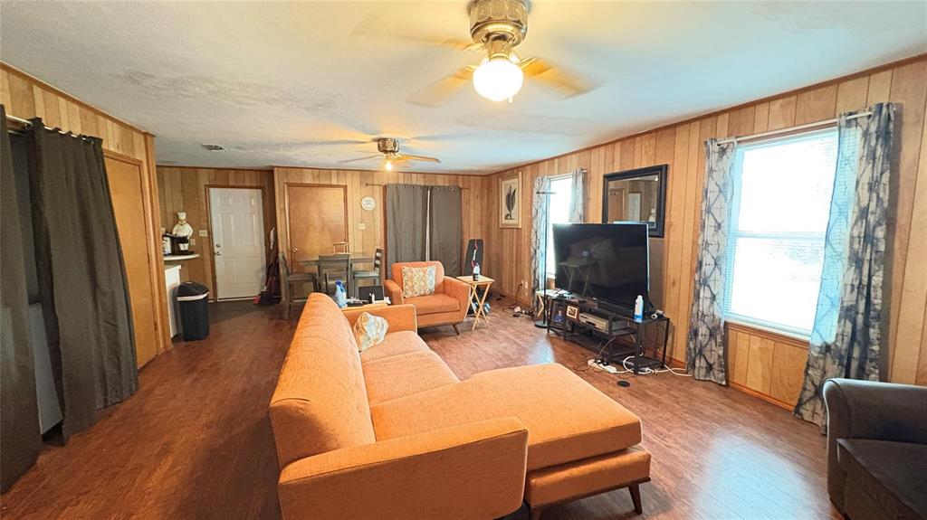 5632 Taylor Road River Oaks, TX 76114 - Photo 3 of 7 a living room with furniture a flat screen tv and a large window