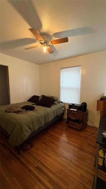 5632 Taylor Road River Oaks, TX 76114 - Photo 5 of 7 a bedroom with a bed and wooden floor
