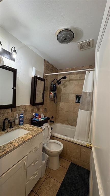 5632 Taylor Road River Oaks, TX 76114 - Photo 6 of 7 a bathroom with a double vanity sink toilet mirror and shower