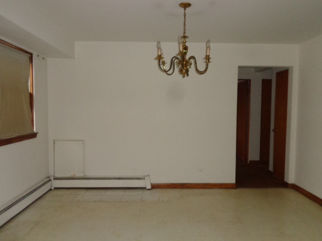 919 Elder Road Homewood, IL 60430 - Photo 4 of 12 a view of an empty room with a window