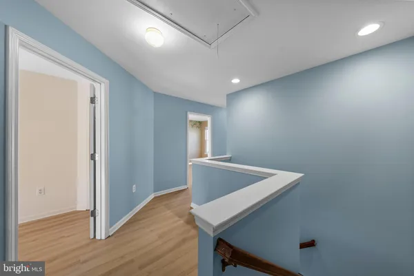 a view of kitchen island with wooden floor