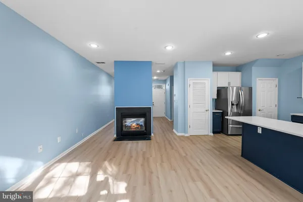 a kitchen with stainless steel appliances a refrigerator and a stove