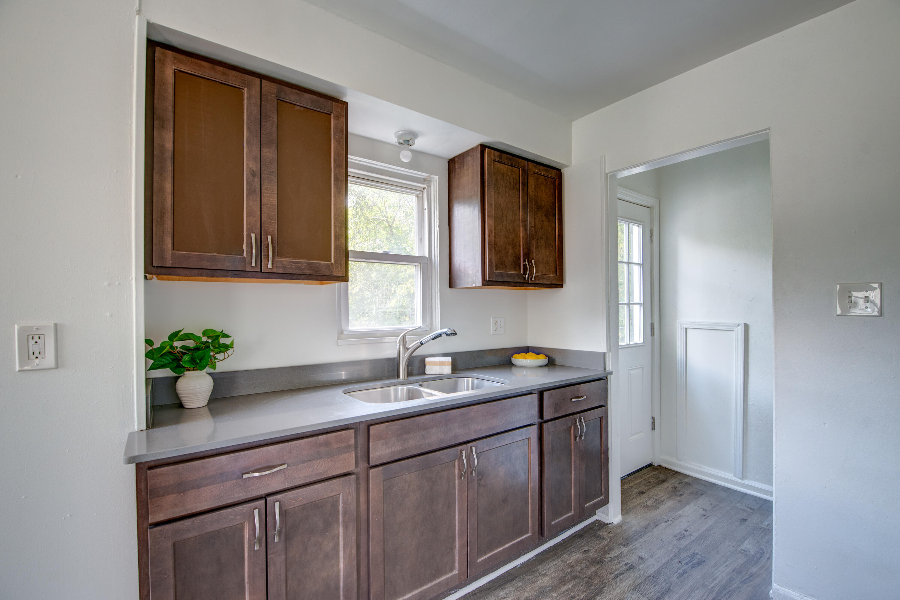 4409 East 11th Avenue Gary, IN 46403 - Photo 11 of 32 a kitchen with a sink and cabinets